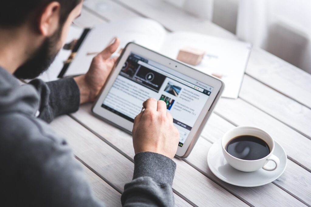 man, reading, coffee cup